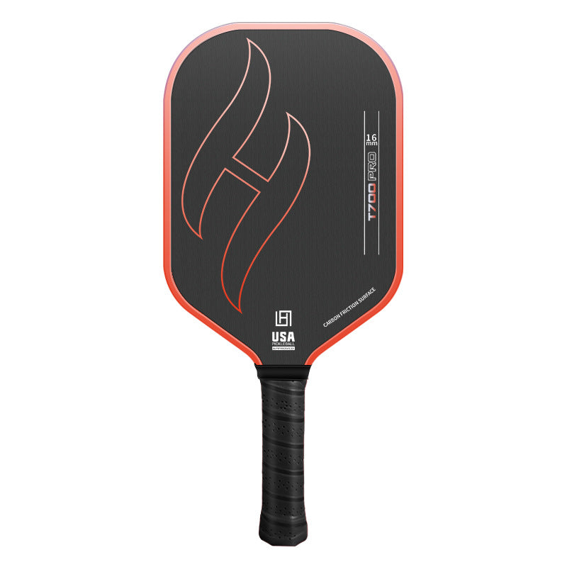 T700 Pro carbon fiber pickleball paddle in gradient orange — black 16mm carbon friction face with flame graphic and black grip, front view