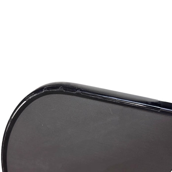 Pickleball paddle with edge guard tape installed, side profile view
