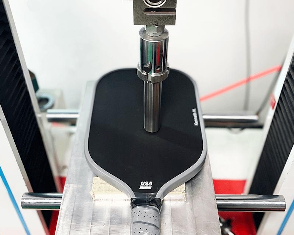 machine testing black pickleball paddle