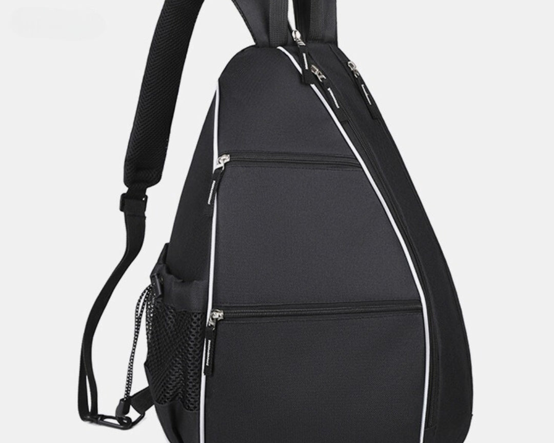 Front view of black pickleball backpack featuring multiple zippered pockets for paddle, phone, keys, and accessories
