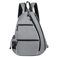 Front view of grey pickleball backpack showing zippered compartments, water bottle pocket, and ergonomic padded straps