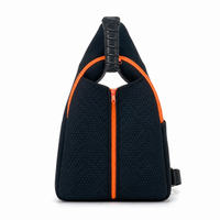 Neoprene pickleball sling bag in light blue with a triangular perforated shell and adjustable crossbody strap