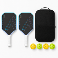 2-player pickleball paddle set in light blue — two T700 carbon fibre paddles, a black zip carry case and four balls