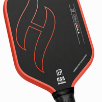 T700 Pro carbon fiber pickleball paddle detail — textured carbon face, flame design and bright gradient edge guard