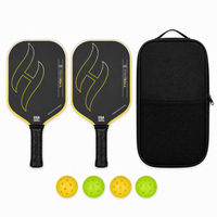 T700 Pro pickleball paddle set in gradient yellow — two carbon paddles with flame graphic, a black zip carry case and four indoor and outdoor balls
