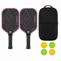T700 Pro pickleball paddle set in gradient red — two carbon paddles with flame graphic, a black zip carry case and four indoor and outdoor balls