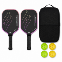 T700 Pro pickleball paddle set in gradient purple — two carbon paddles with flame graphic, a black zip carry case and four indoor and outdoor balls