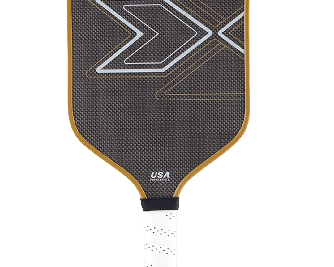 Close-up detail of PickleballDoor titanium wire carbon fiber pickleball paddle face, showing textured weave surface and bold aerodynamic graphic design