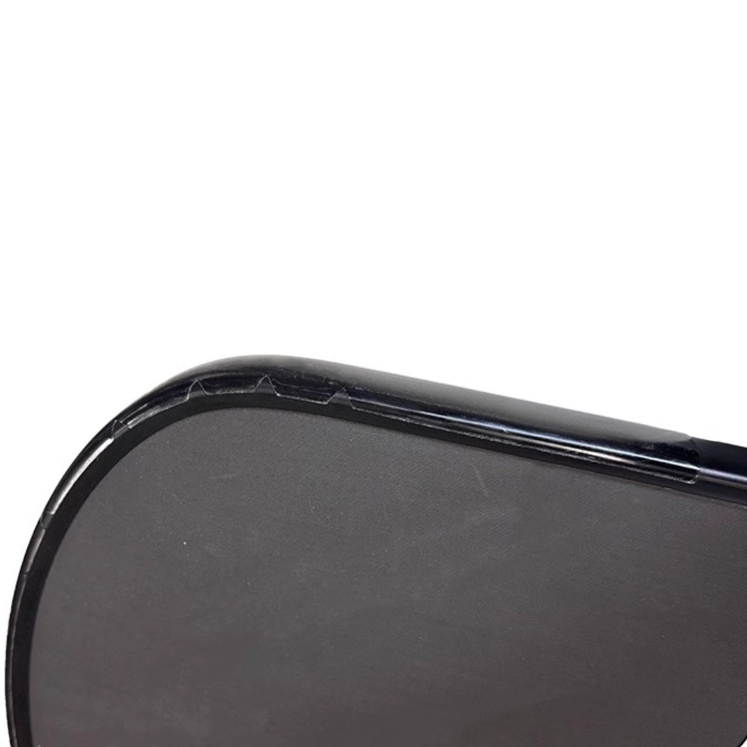 Pickleball paddle with edge guard tape installed, side profile view