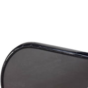 Pickleball paddle with edge guard tape installed, side profile view