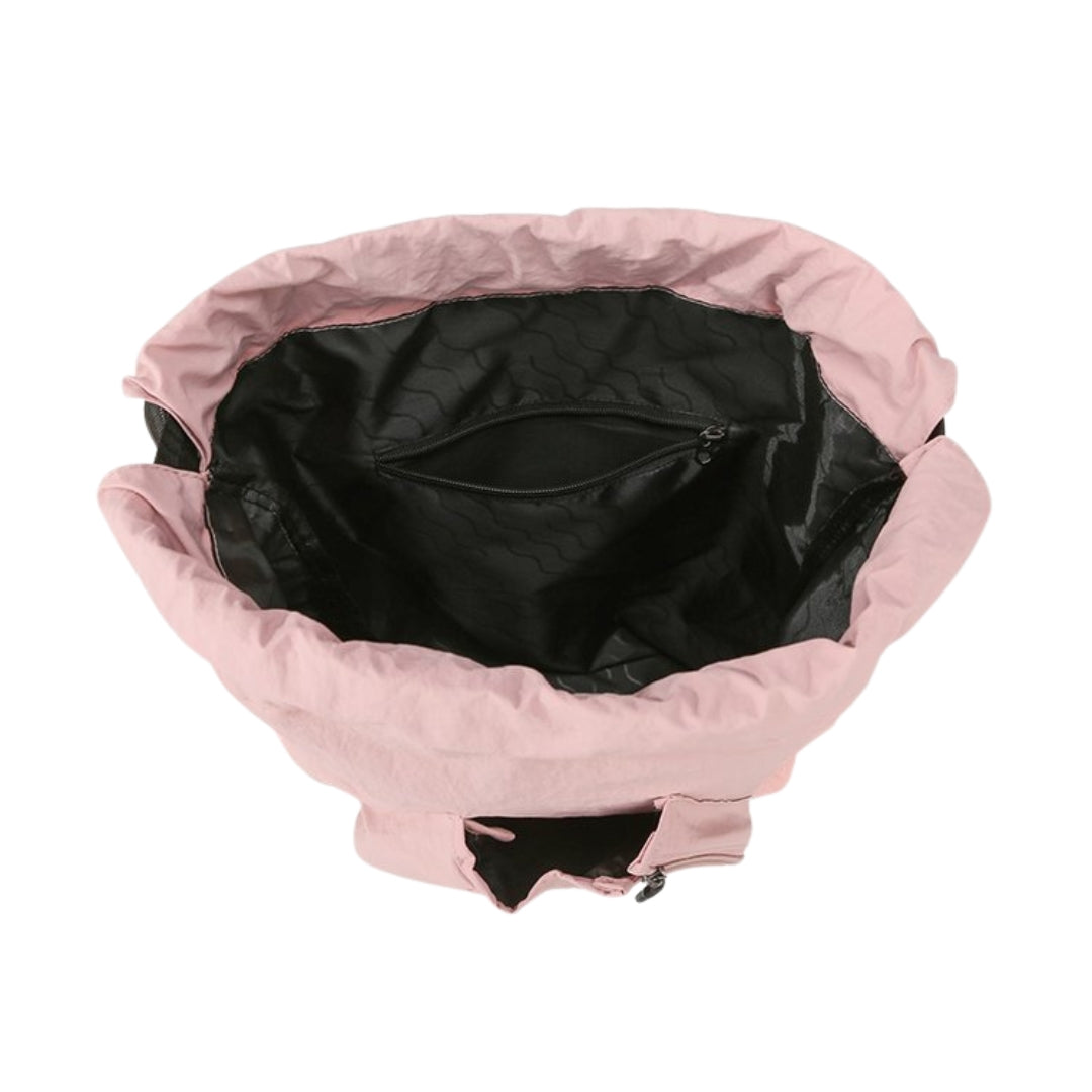 Inside view of pickleball racket bag with padded paddle sections, zippered pockets, and organized accessory storage