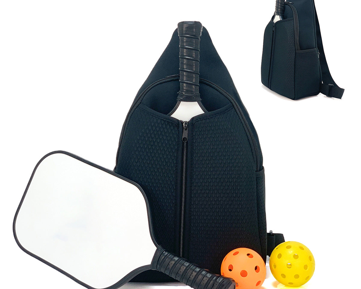 Marine neoprene pickleball sling bag with honeycomb texture and adjustable crossbody strap shown with paddle and pickleballs