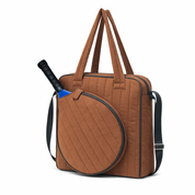 Brown 10L pickleball tote bag with diagonal quilted stitching and blue pickleball paddle sticking out of the front pocket, three-quarter angle view