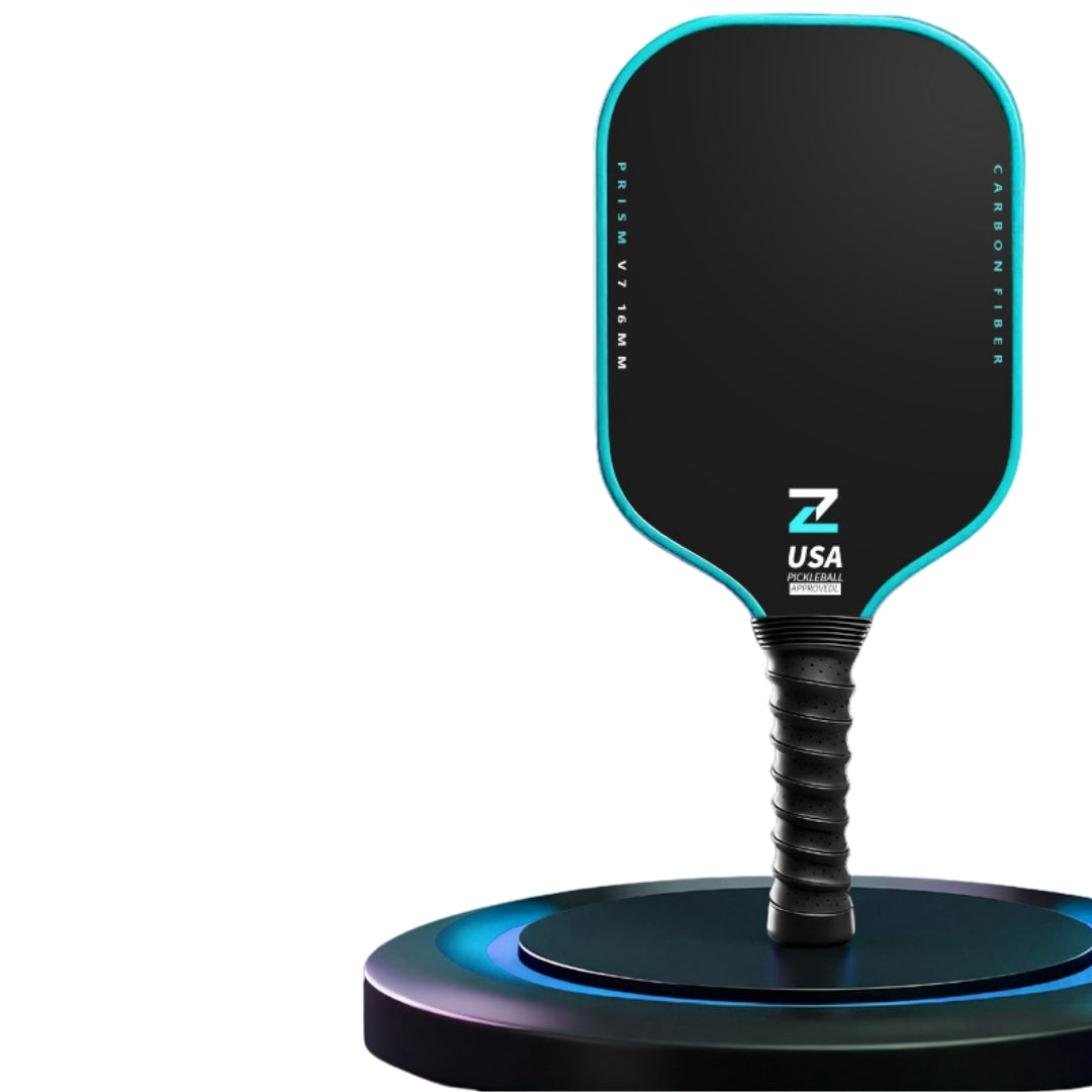 Prism V7 carbon fiber pickleball paddle in blue with T700 matte friction surface, premium TPU edge guard and shock-absorbing black ribbed grip