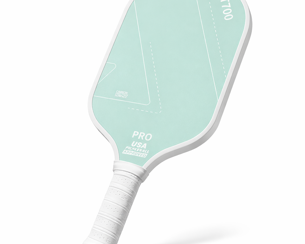Pale mint green 16mm carbon fiber pickleball training paddle with cushioned white handle