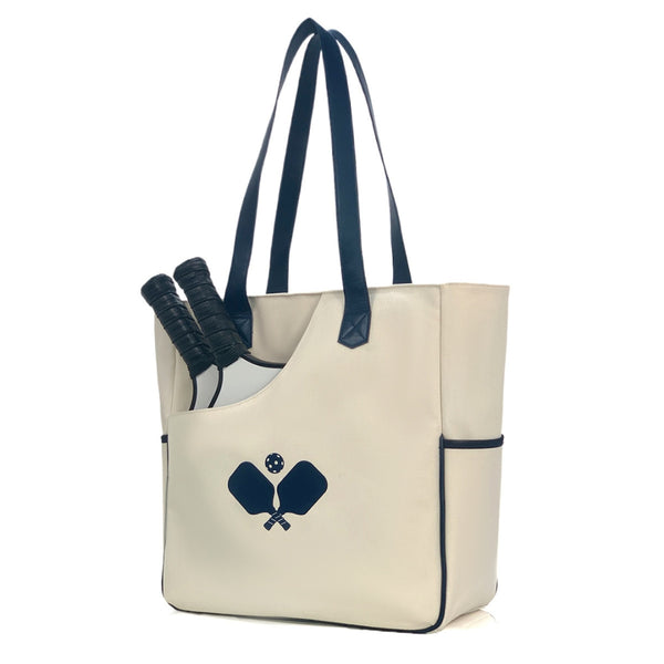 Women's pickleball bag in white racket pattern, convertible tote and backpack design with quilted paddle protection