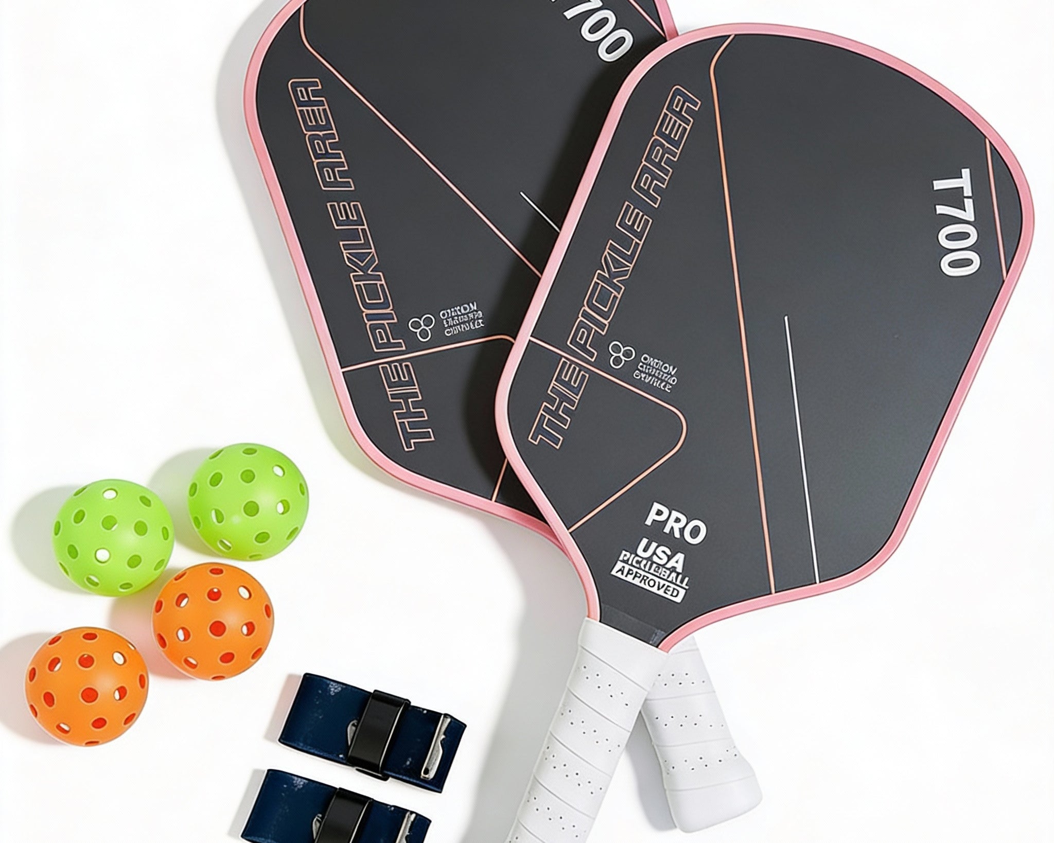 Pink pickleball paddle set of 2 featuring paddles, 4 balls and grip protection tape overhead