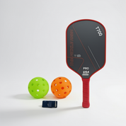 Red pickleball paddle set with ball and protective handle tape front view